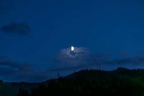 Moon over a range of hills, Mugel mountain, Leoben, Styria, Austria, Europe