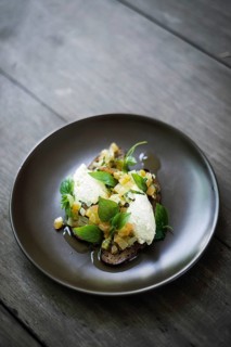Ricotta cheese and salad with herbs on rye bread