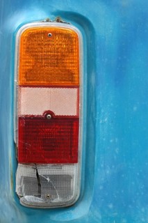 Detail of a Brake Light on a Weathered Vintage Camper Van
