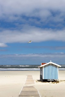 Lonely sandy beach with lifeguard tower, on the German North Sea coast