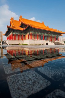 Taipei National Concert Hall beautifully reflected in a puddle of rainwater