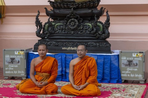 Monks in front of a Buddha statue, Bhumispara-mudra, Buddha Gautama at the moment of enlightenment,