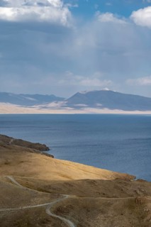 View of mountain landscape with piste at Lake Song Kul, Naryn region, Kyrgyzstan, Asia