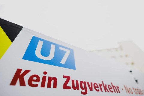 A sign indicates the suspension of train services on the underground line 7 in Berlin, 27 February