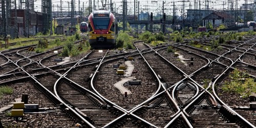 Track apron with rails, infrastructure and a local train at the main railway station, Frankfurt am