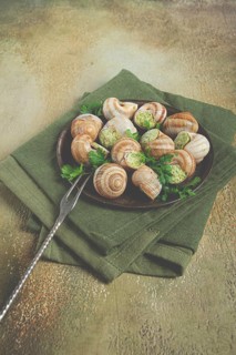 Grape snails stuffed in Burgundy, with butter and herbs, French cuisine, no people