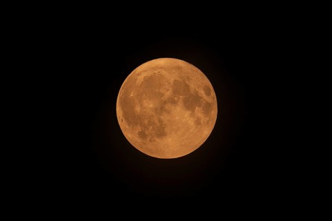 Blue full supermoon above Belgium glows red because of North American wildfire smoke in the