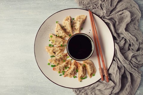 Japanese Gyoza dumplings, fried, with sauce, top view, without people, tinted, selective focus