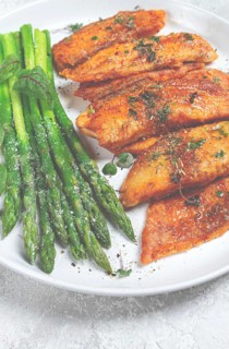 Fried fish fillet, tilapia with asparagus, homemade, no people