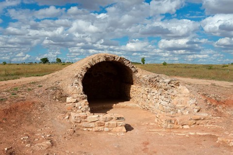 A stone vault in an archaeological site under a cloudy sky, Cueva, cave, Cerro de los molinos, mill