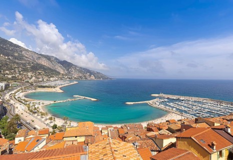 Scenic panoramic view of Menton seashore promenade and historic city in French Riviera Cote D azur