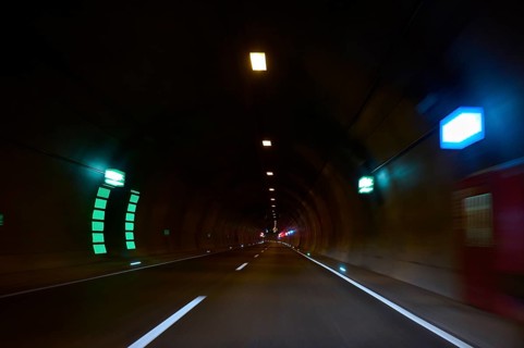 Motorway tunnel A71 with illuminated road and modern light installations offering a perspective