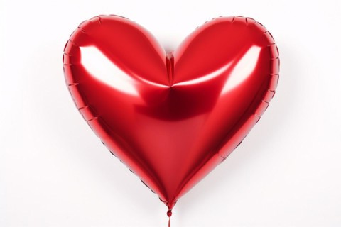Red heart shaped foil balloon on white background. KI generiert, generiert, AI generated