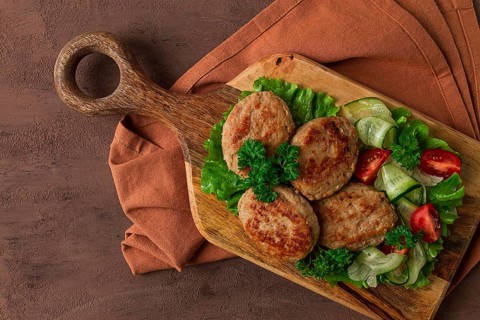 Fried cutlets, turkey, with vegetable salad, top view, no people
