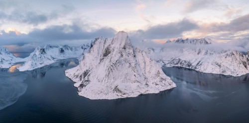 Snowy mountains by the fjord, Mount Olstinden, Reinefjord, Reine, Lofoten, Norway, Europe