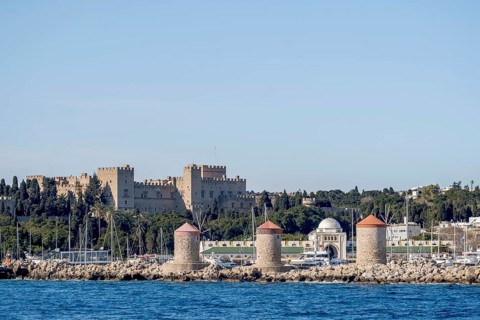 Exit from the harbour, view of the Grand Master's Palace and the three windmills, Rhodes,