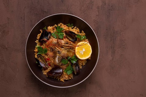 Seafood paella, shrimp and mussels risotto, rice, homemade, top view, no people