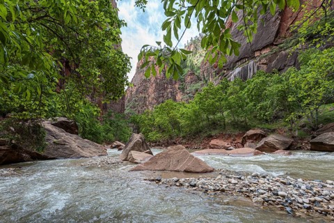 Virgin River runs between sandstone rock formations along the Riverside Walk in the Temple of