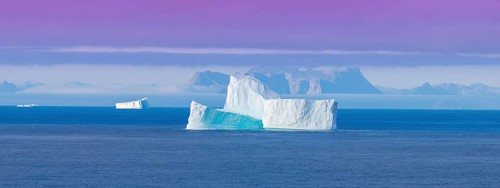 Iceberg seen from cruise ship vacation near Greenland coast in Arctic circle near Ilulissat Disko