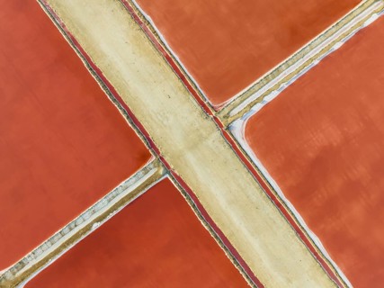 Saline ponds at the Bonanza salt works near Sanlúcar de Barrameda. The red colour depends on the