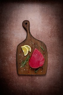 Fresh red tuna fillet, for steak, raw, top view, on a cutting board, no people