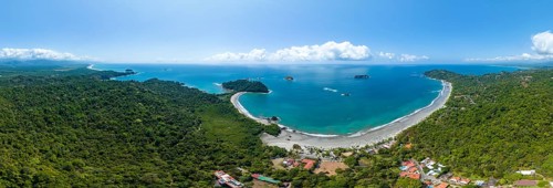 Aerial view, coast and town, Corrohoe Bay and Playa Espadilla, Manuel Antonio National Park,