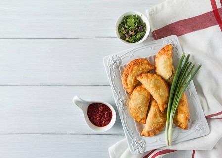 Fried chebureks, close-up, on a light background, no people