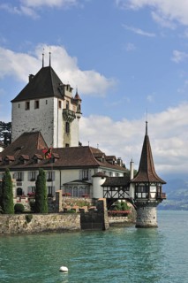 The water castle Schloss Oberhofen along the Tunersee, Lake Thun in the Bernese Alps, Switzerland,