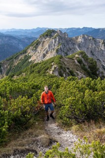 View over the mountain ridge of the Schindergebirge to the Bavarian Schinder, mountaineer on hiking