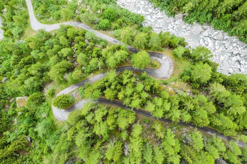 Aerial view, drone shot, windy road along a river, mountain valley, Switzerland, Europe
