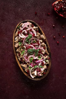 Kuchmachi, Traditional Georgian cuisine, chicken giblets appetizer, with spices and pomegranate