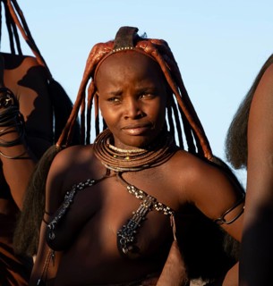 Traditional Himba woman, portrait, in the evening light, near Opuwo, Kaokoveld, Kunene, Namibia,