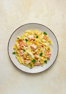 Tagliatelle pasta, in cream sauce with salmon, homemade, no people
