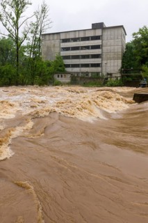 Symbolic image extreme weather, global warming, climate change, flood, flooded weir in Remseck an