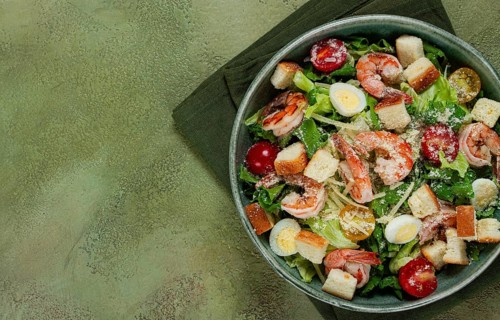 Caesar salad, with tiger prawns, shrimp salad, lettuce, quail eggs, cherry tomatoes, parmesan