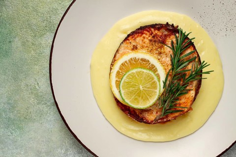 Salmon steak, fried, mashed potatoes, top view, rosemary, lemon and lime, homemade, one serving, no