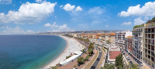 France, panoramic skyline of old historic Nice center and azure beaches along Promenade des