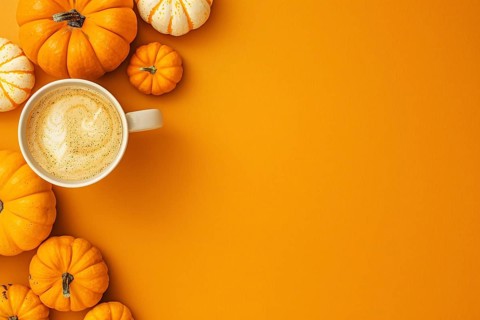 Pumpkins and pumpkin spice latte on orange background with copy space. Generative Ai, AI generated