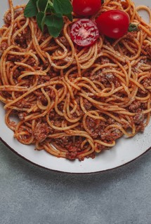 Spaghetti bolognese, in a frying pan, top view, homemade, no people