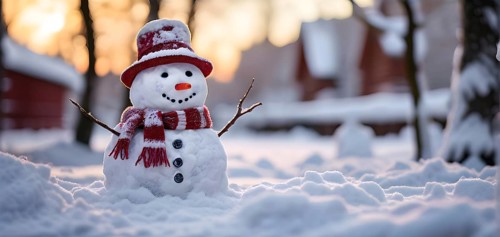 Snowman in an idylic winter urban scenery, snow-covered streets and buildings in background,