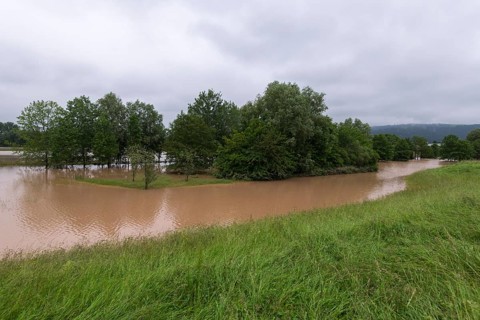 Symbolic image extreme weather, global warming, climate change, flood retention basin, flood