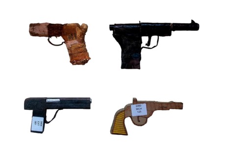 Fake handguns like imitation revolver and wooden semi-automatic pistols made by prisoners, inmates