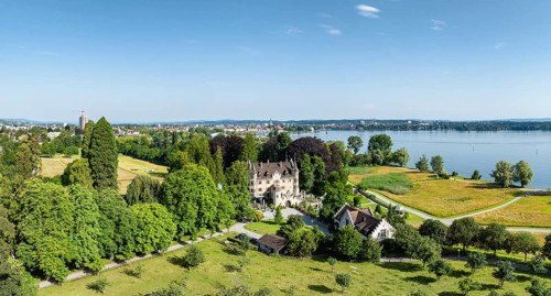 Aerial view, panorama of Seeburg Castle with integrated catering and event location in Seeburgpark