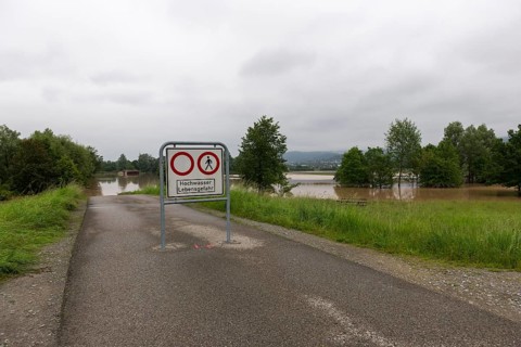 Symbolic image extreme weather, global warming, climate change, information board, flood retention
