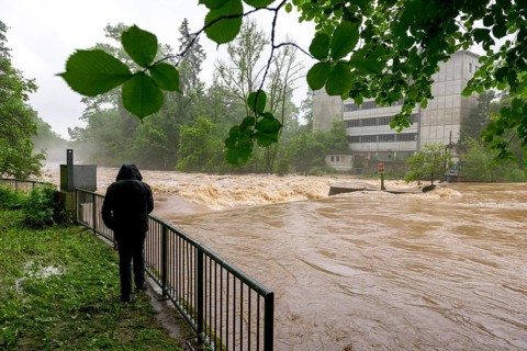 Symbolic image extreme weather, global warming, climate change, flood, flooded weir in Remseck an