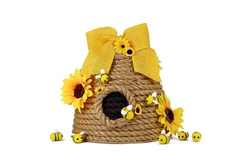 DIY rope beehive decoration with fake flowers, jute rope and cute felt bees on white background