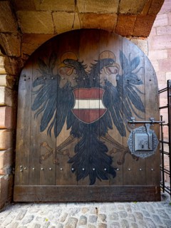 Entrance gate with coat of arms, coat of arms of the city of Nuremberg with double-headed eagle,
