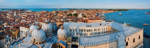 Aerial panorama of Venice with St Mark's Basilica and square and Doge's Palace on sunset from St