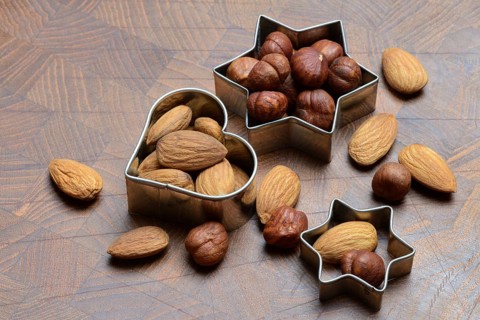 Nuts and cookie cutters, almonds and hazelnuts