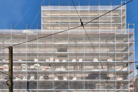 Karlsruhe, Germany, August 2021: Large construction site with scaffolding on multistory building